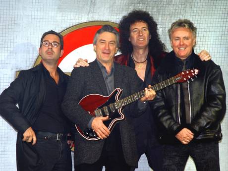 Don’t stop me now: Ben Elton, Robert De Niro, Brian May and Roger Taylor in 2002 (Getty)