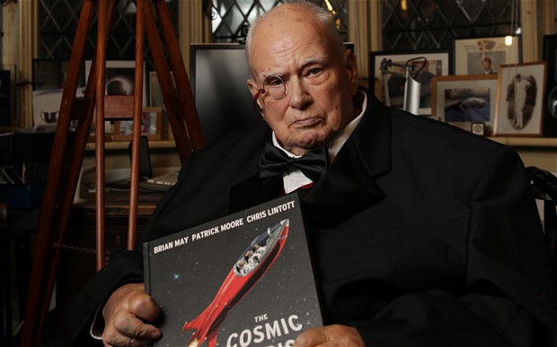 Book launch of "The Cosmic Tourist" by Brian May, Patrick Moore, Chris Linstott at Patrick Moore's house in Selsey, Sussex, UK. Pictured Patrick Moore with the book. 17 October 2012Sir Patrick, who fronted BBC1's Sky at Night since its launch in 1957, cultivated a 'mad professor' image which attracted millions of viewers Photo: RII SCHROER