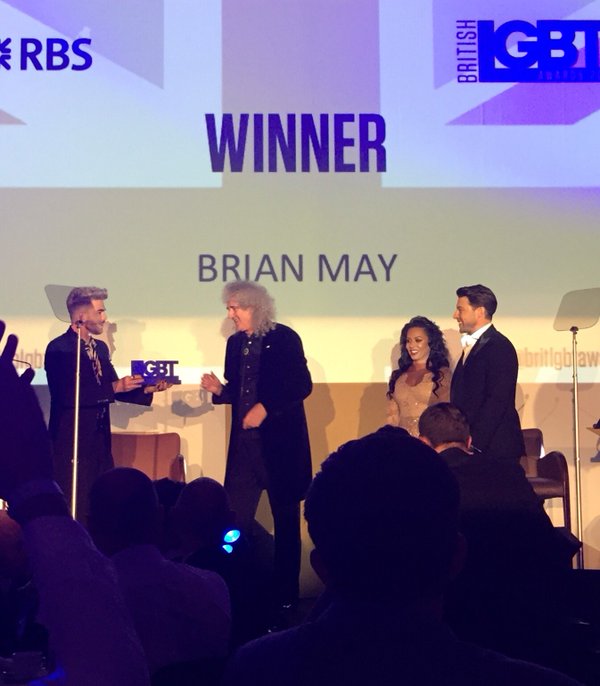 Bri receiving Straight Ally Award from Adam Lambert
