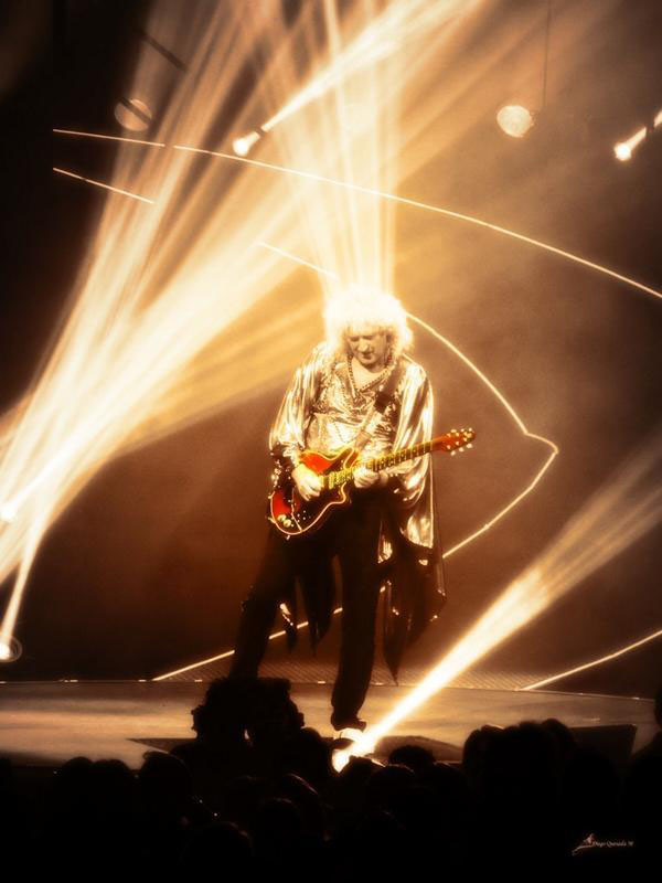 Brian May playing solo - gold outfit