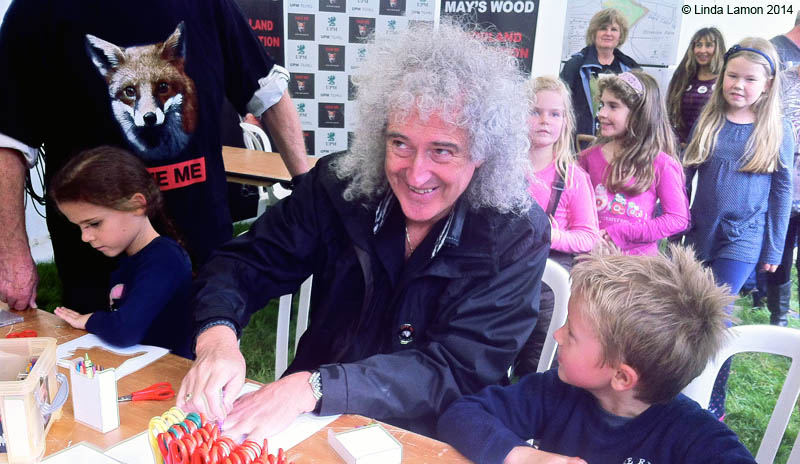 Brian May with pupils of Bere Regis Community School