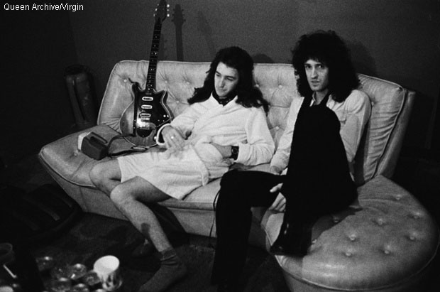 John Deacon and Brian May chill out on sof