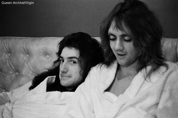 John Deacon and Roger Taylor backstage in dressing gowns