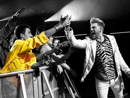 Adam with audience member in yellow jacket