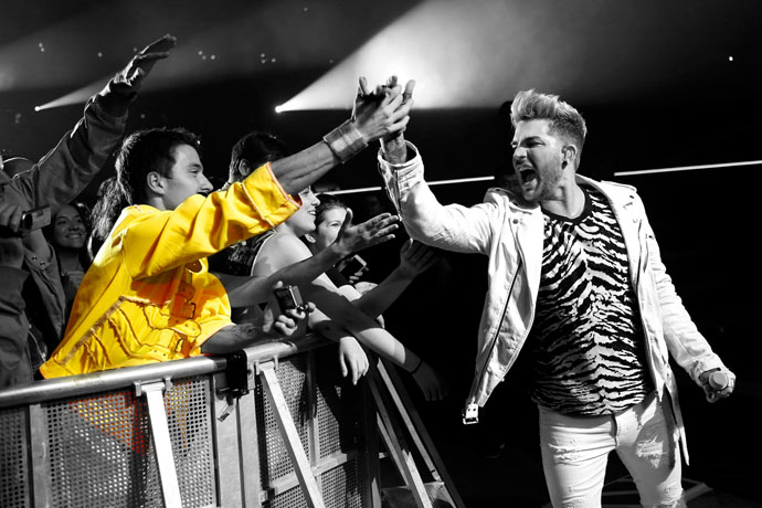 Adam with audience member in yellow jacket