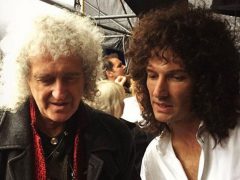 The real Brian May and Gwilym Lee on set