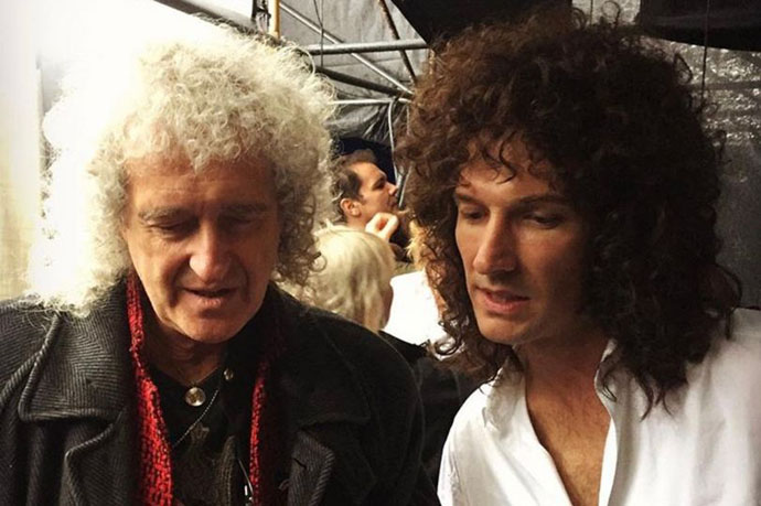The real Brian May and Gwilym Lee on set