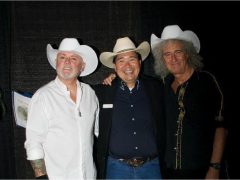 Roger Taylor and Brian May in Calgary hats
