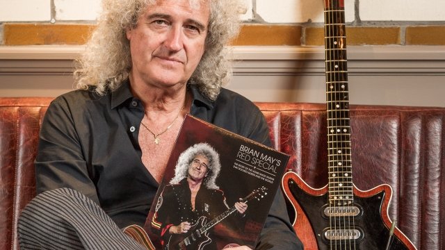 Brian May with Red Special and book