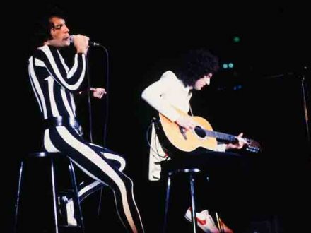 Freddie in striped leotard - on stage with Brian