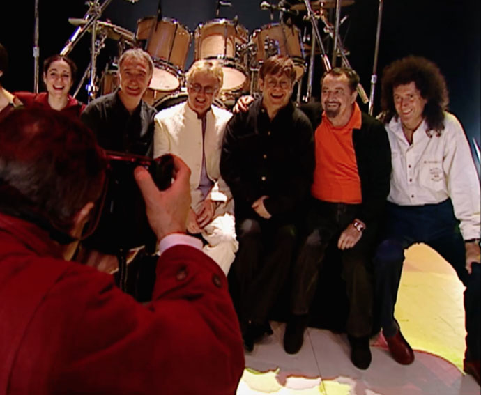 Maurice Bejart seated with Brian May, Roger Taylor et al, Paris