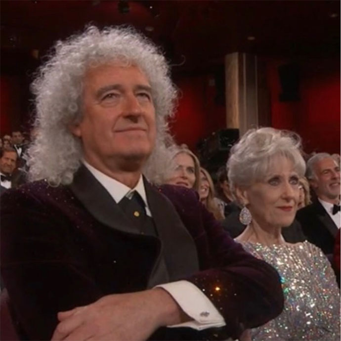 Brian and Anita watch Rami receive Best Actor Oscar