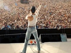 Rami Malek singing to Live Aid crowd