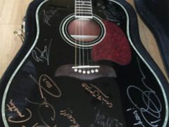 Signed guitar for Save Me + another charity