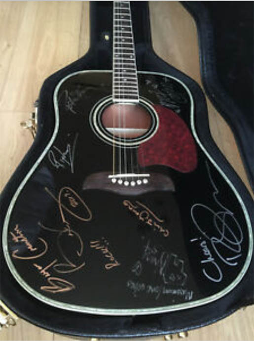 Signed guitar for Save Me + another charity
