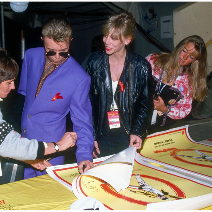 David Bowie signing FM Tribute Concert poster