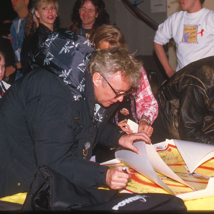 Roger Taylor signing FM Tribute Concert poster