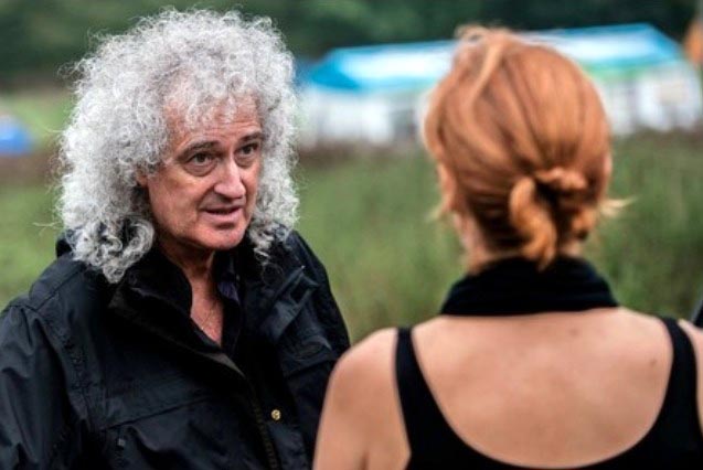 Brian May talks to a protester