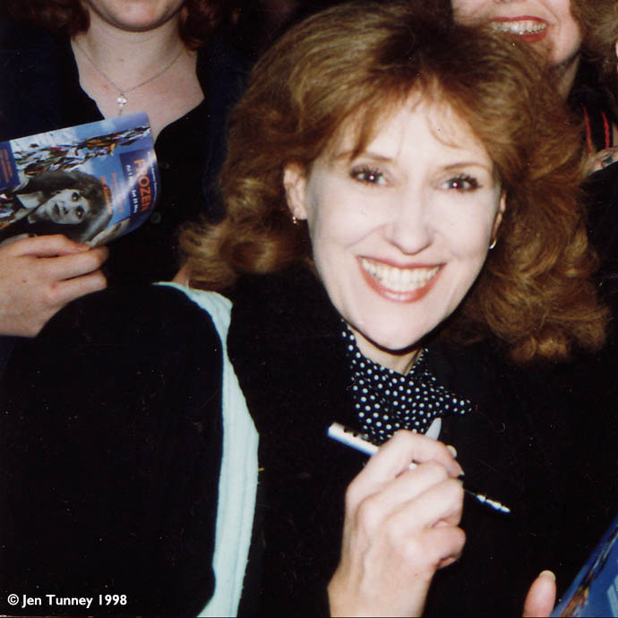 Anita signing programmes for friends and fans