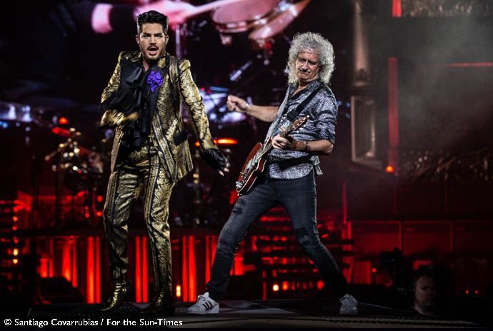 Chicago - United CenterAdam Lambert (left) sings alongside Queen guitarist Brian May at the band’s concert  Friday at the United Center. Santiago Covarrubias / For the Sun-Times 