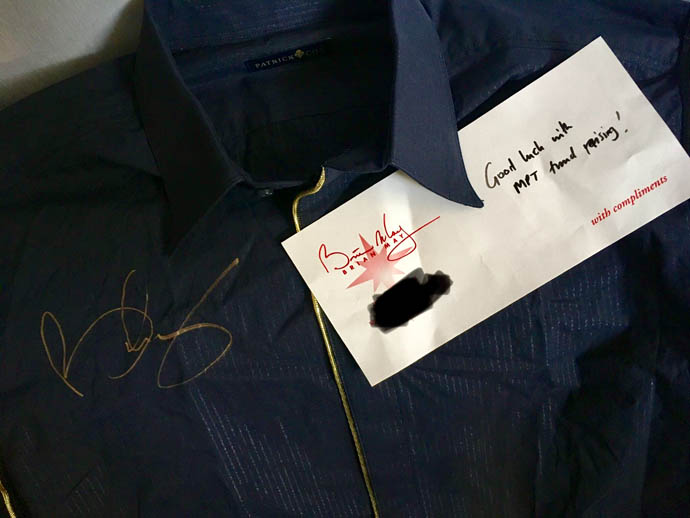 Brian's black shirt with gold signature