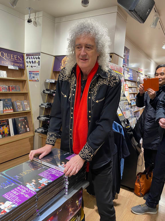 Brian with stack of Queen In 3-D books, Tower Records, Tokyo