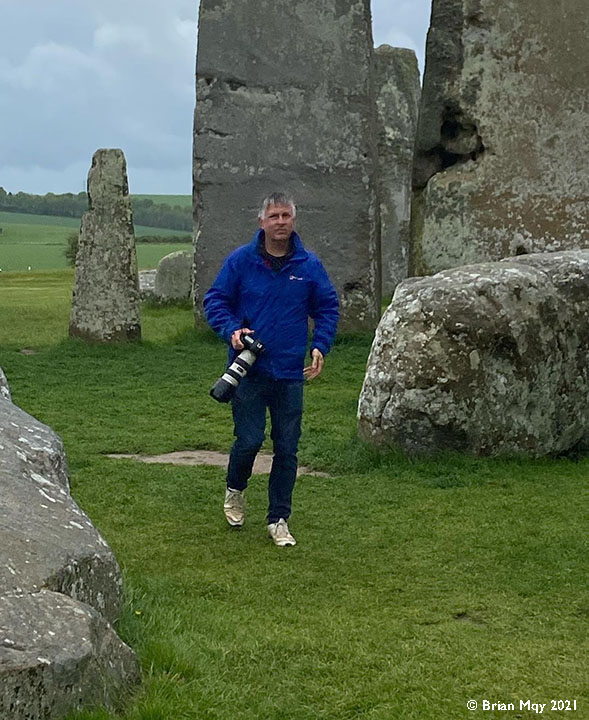Jamie Cooper with camera at Stonehenge by Brian May