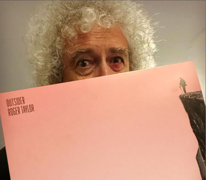 Brian with Roger Taylor album