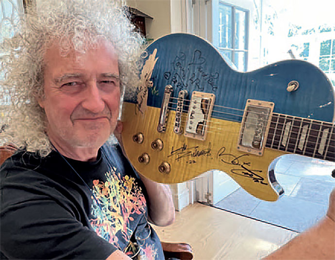 Brian with blue and yellow Gibson Les Paul