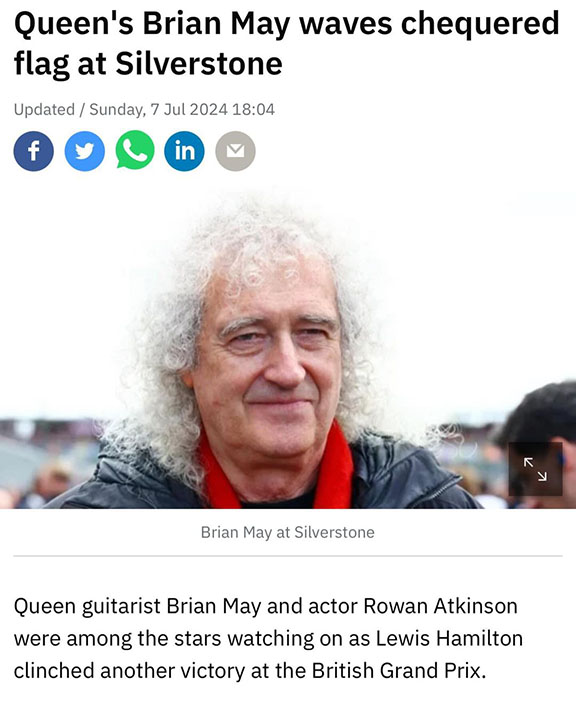 Queen's Brian May waves chequered flag at Silverstone - 